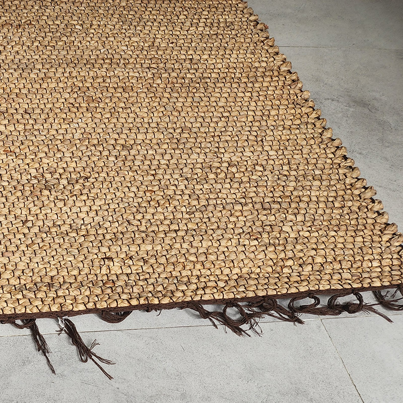 Woven water hyacinth wall paneling and acoustic ceiling lining in resort lobby